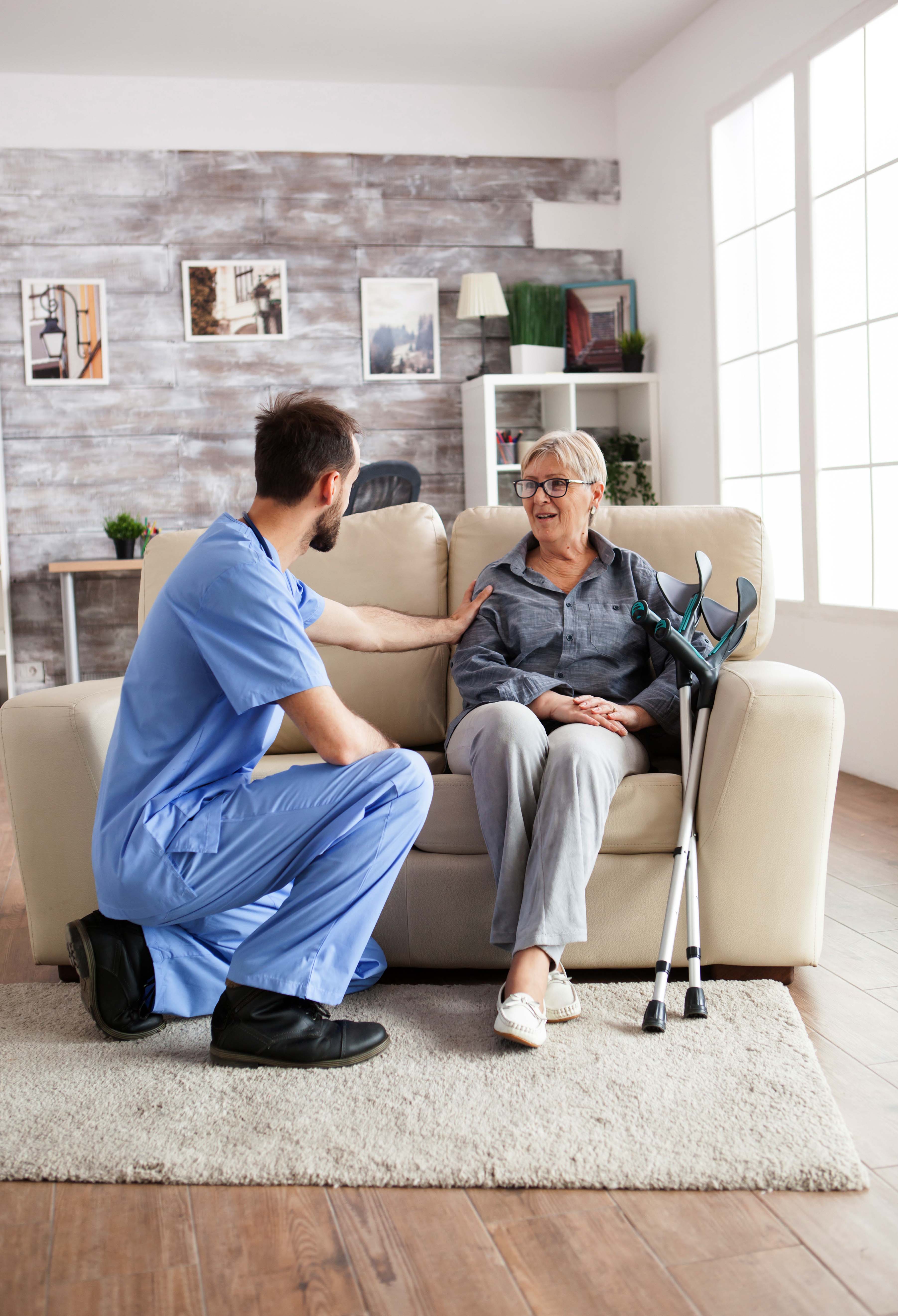 Noble Care carer sharing a warm moment with elderly client at home