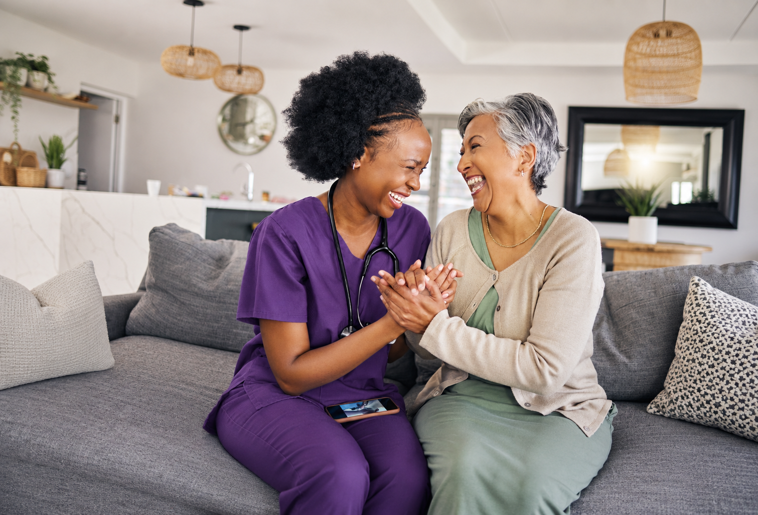 Noble Care nurse sharing a warm moment with elderly client at home